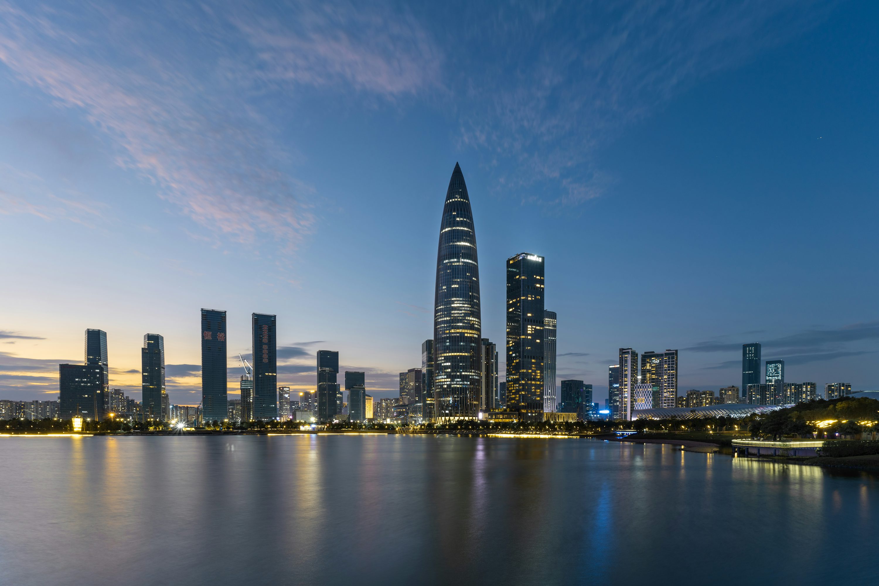 Shenzhen Bay skyline and commercial towers at dusk
